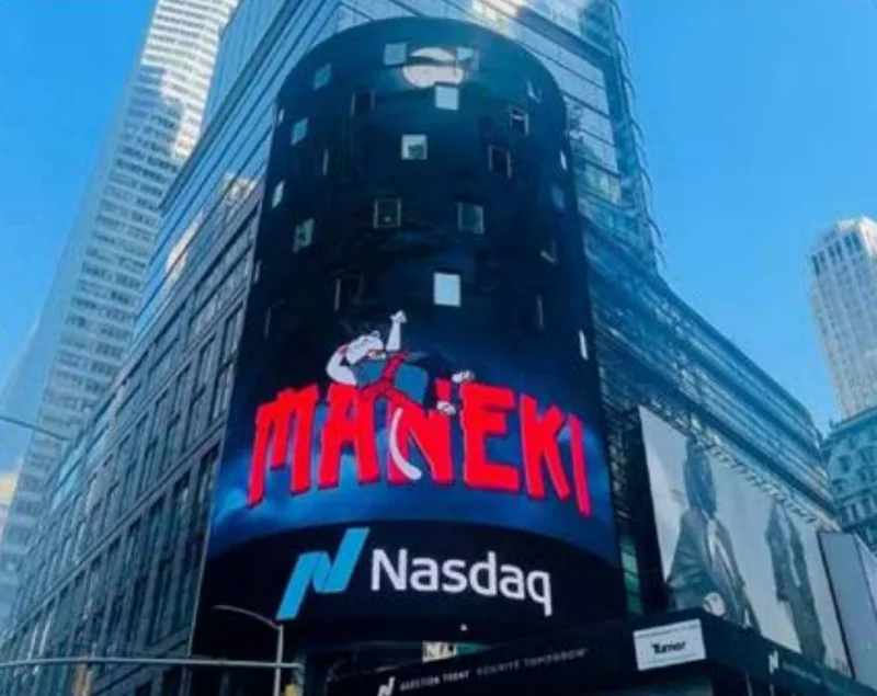 The MANEKI cat and wordmark on the Nasdaq tower screen in Times Square